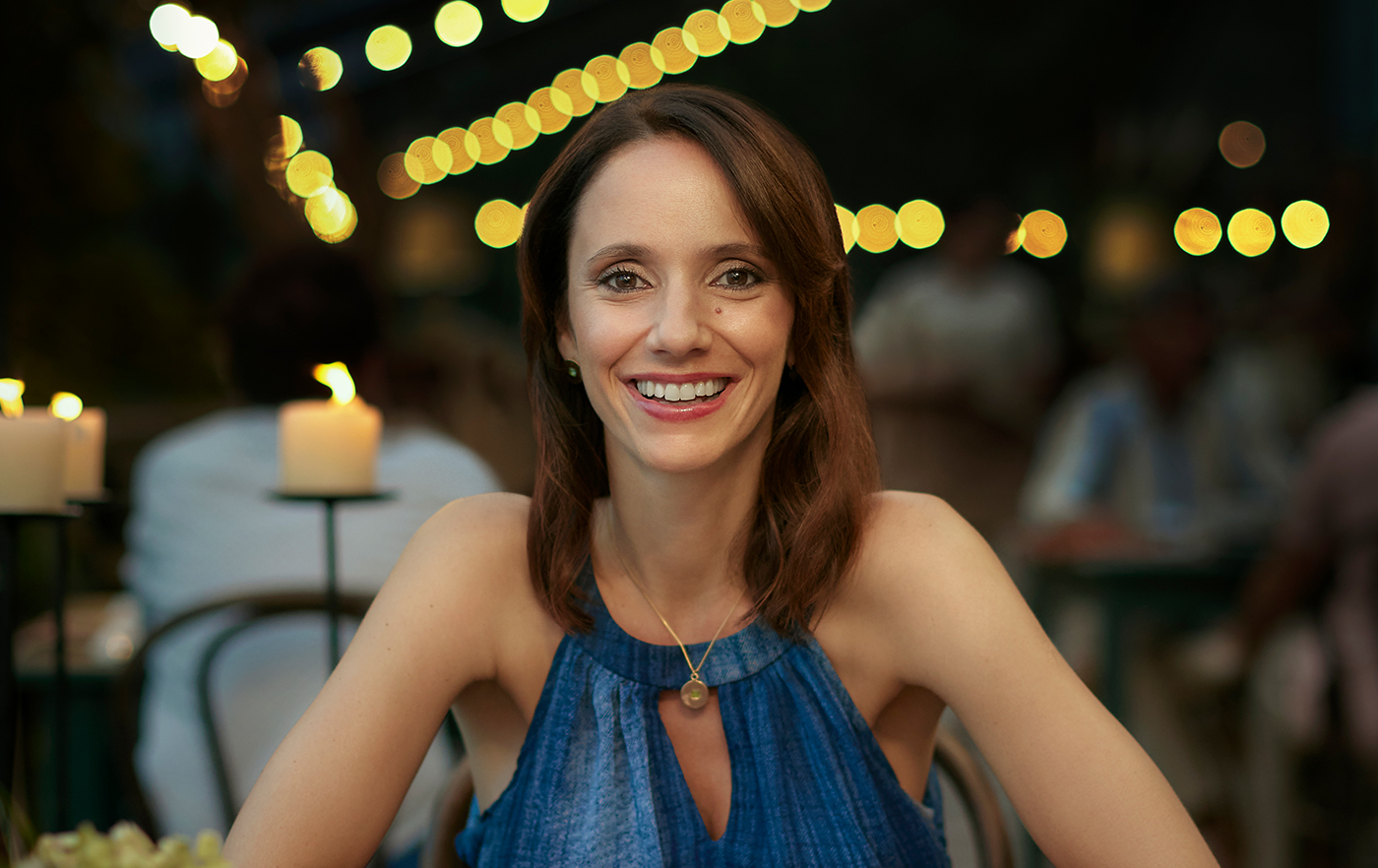 Woman smiling in a restaurant